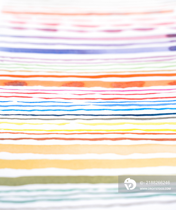 Abstract watercolor lines pattern background. Colorful watercolor painted brush strokes on white.