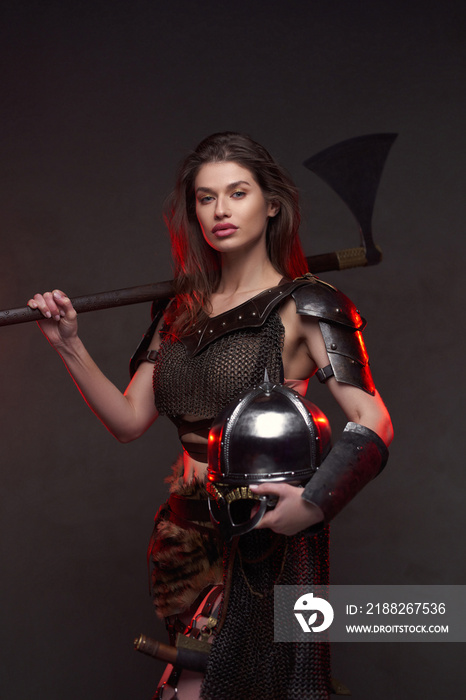 Nordic woman viking with axe on her shoulder