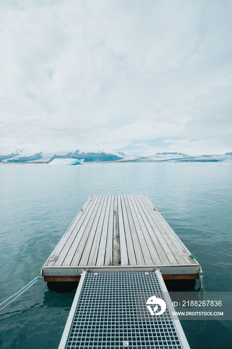 Tranquil pier backgrounds landscape of the Jokursalron scene. Freedom liberty and scape concept. Natural and wild Iceland view. Adventure vacations healthy lifestyle backpacking. Follow your dreams