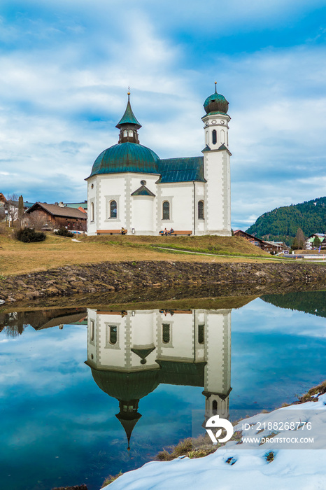 Seefeld Seekirchl Church with Water reflection in winter without snow