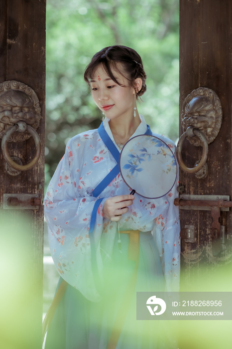 A young Chinese woman wearing traditional Han clothing.