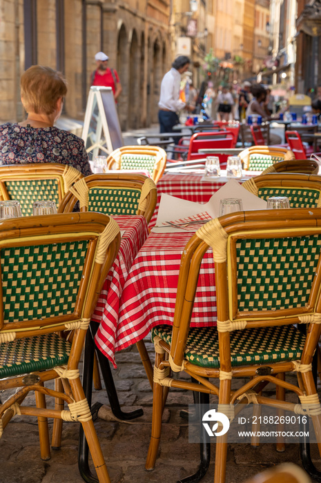 Tourist destination, views of houses and traditional bouchon cafe in old central part of Lyon in summer, France