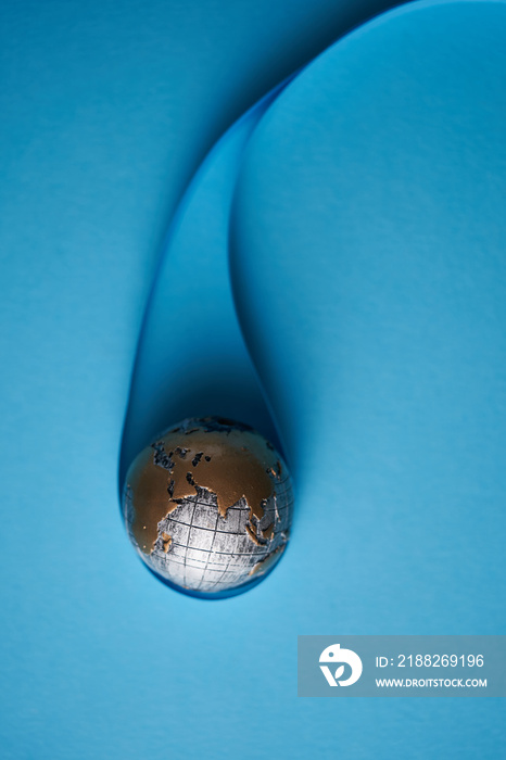 Ecology and Pollution Concept : Blue planet earth globe in water drop with blue background