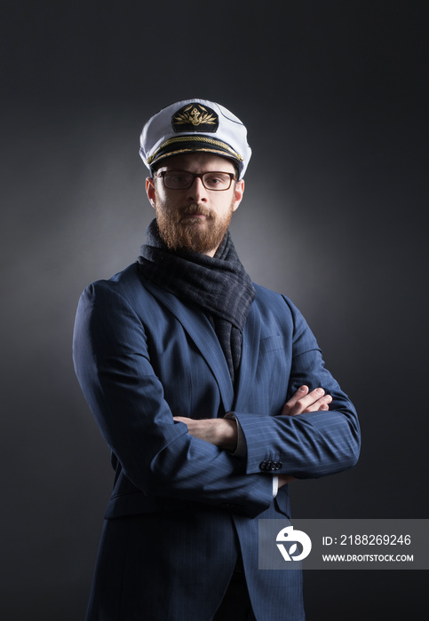 Portrait of a handsome sailor on a dark background