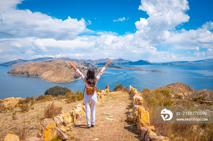 latin woman traveling on isla del sol in lake titicaca in summer