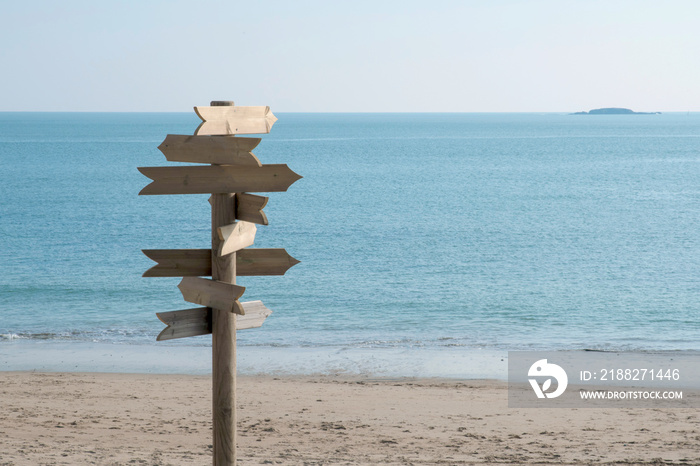 Signs without text on a beach by the sea