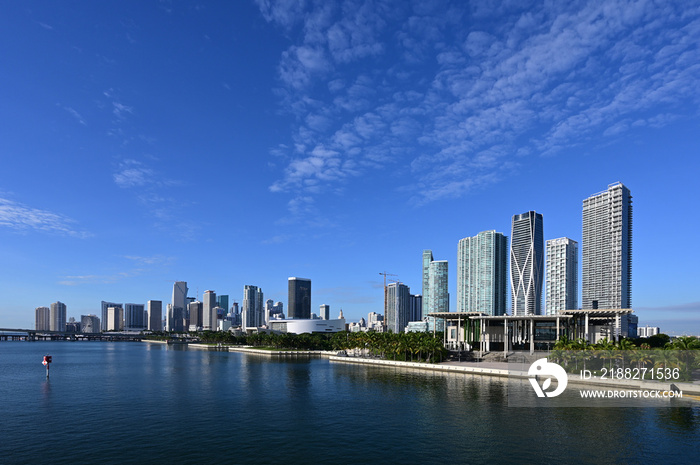 City of Miami, Florida reflected in calm water of Biscayne Bay on sunny autumn morning.