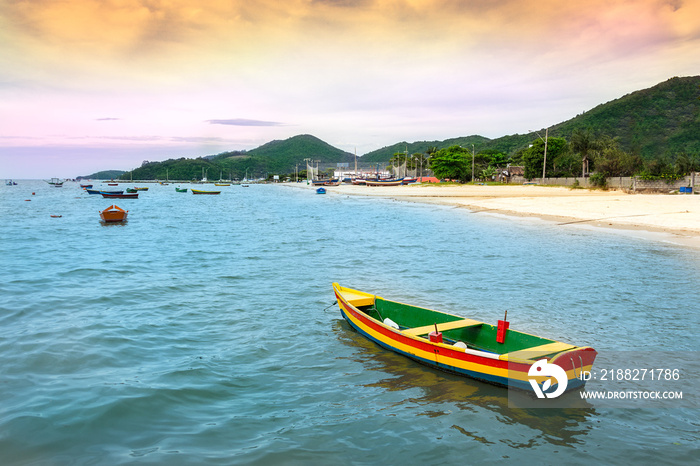 Colorful wooden fishing boat at the beach in Porto Belo.