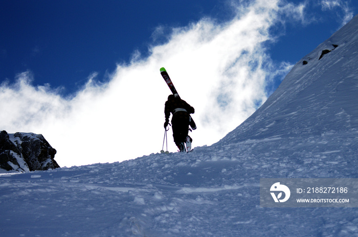 Skier climbing up