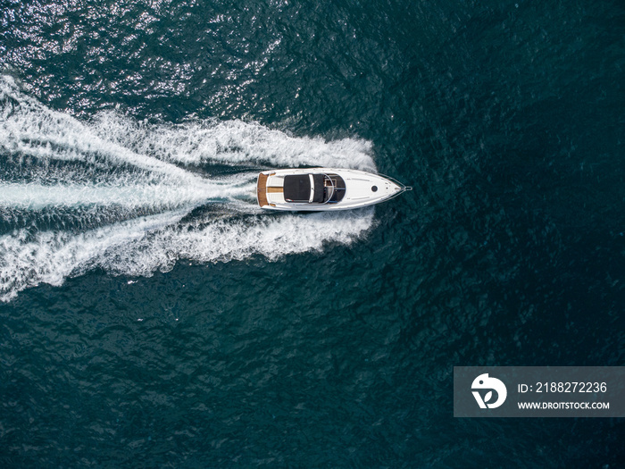 Aerial view of speed motor boat on open blue sea