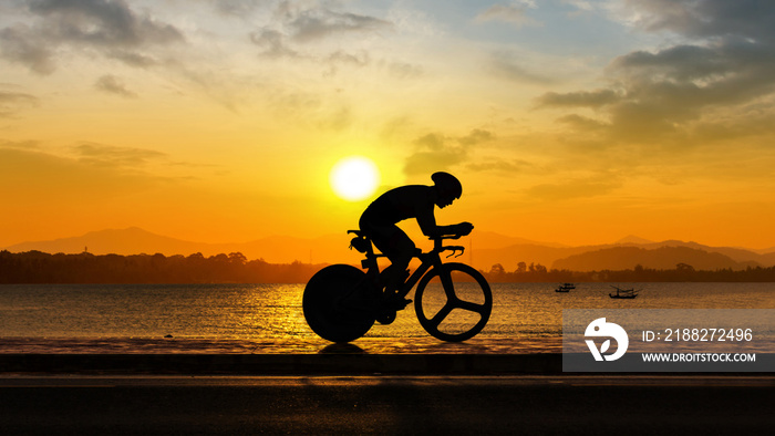 Man cycling at beach evening time