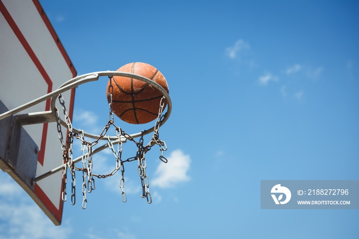 Low angle view of basketball in hoop