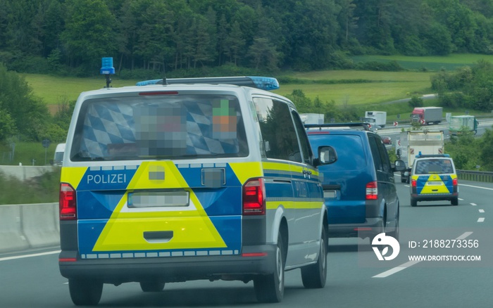 Police Cars driving on Motorway