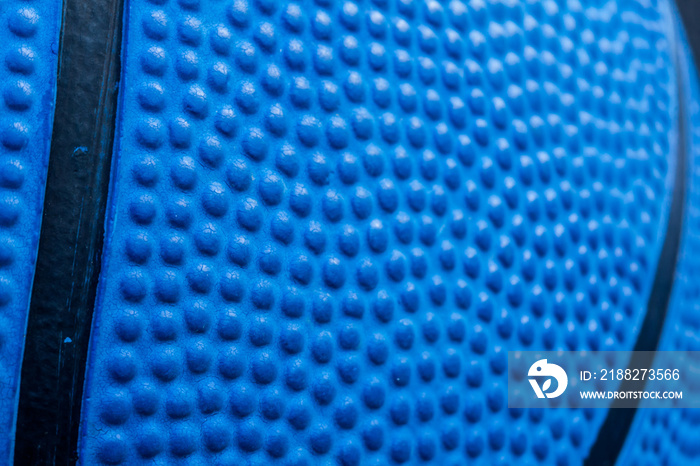 Blue basketball texture with lines, macro close-up.