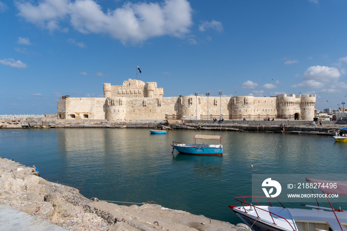 Citadel of the city of Alexandria, seen from the part of the sea full of ships, on a sunny day.