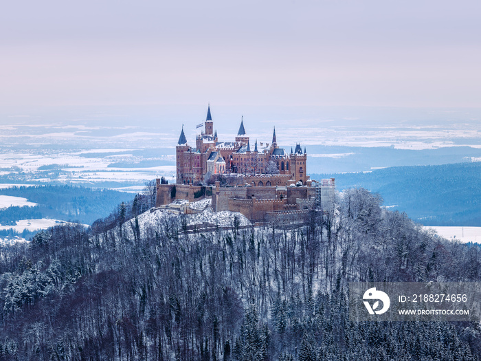 Elevated view of Hohenzollern Castle covered in snow, Baden Württemberg, Germany