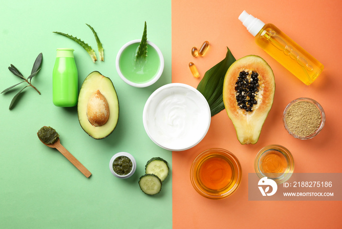 Flat lay composition with fruits and natural cosmetics on color background