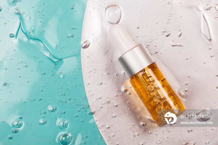 Bottle of hyaluronic acid on background with oxygen bubbles.