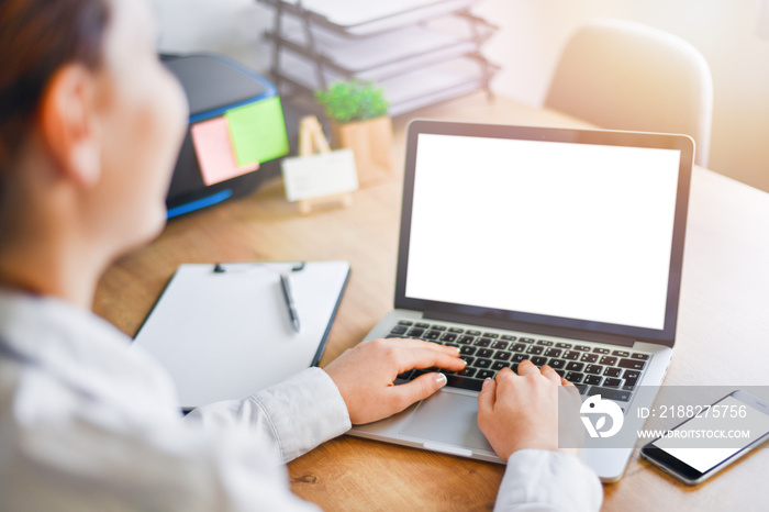 Woman working on laptop in office. Mockup Copyspace Computer or Notebook Concept