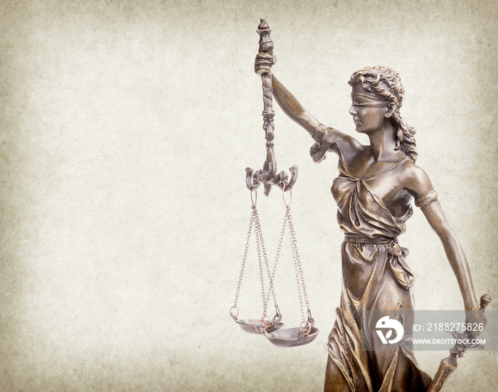 Statue of justice on old paper background, law concept