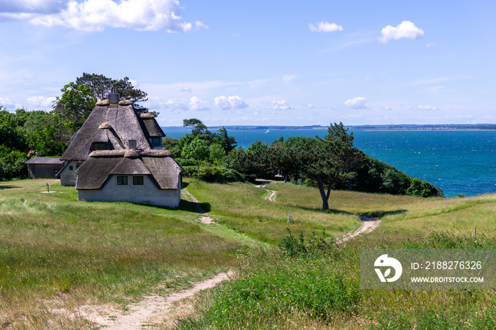 view of the home of artic explorer Knud Rasmussen and shoreline in northern Zealand