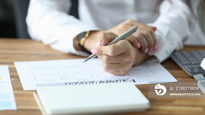 Female writing down in schedule