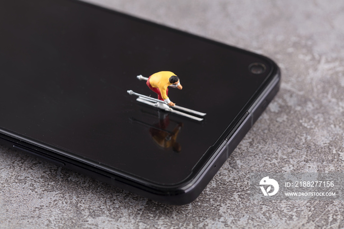 A skier swimming on a miniature creative mobile phone