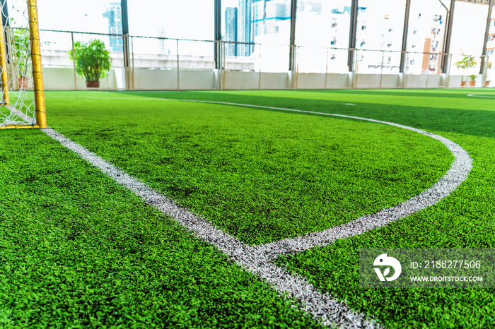 White round goal line on green grass for sport soccer field with nobody for background