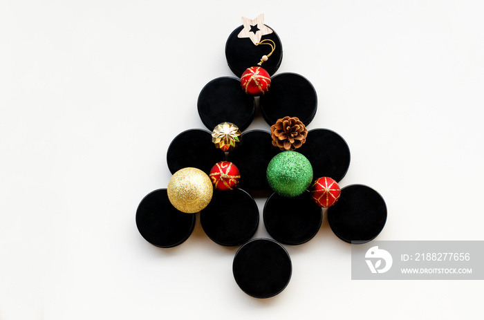 Christmas tree made from hockey puck . Top view. Christmas and New Year Holidays concept. Hockey Christmas tree