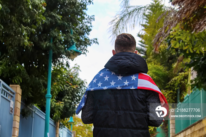 United States Patriot with american flag on shoulders