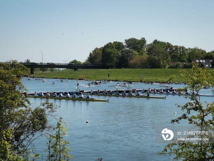 Sports event  115. Große Bremer Ruder-Regatta  on Lake Werdersee. Rowing Championship. . A regatta race under blue sky and sun. Bremen, Germany