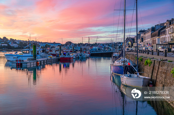 Breathtaking colorful sunrise over the harbor of Audierne, Brittany, France