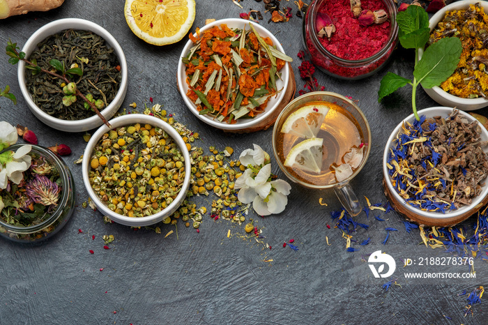 Herbal tea assortment on dark background.