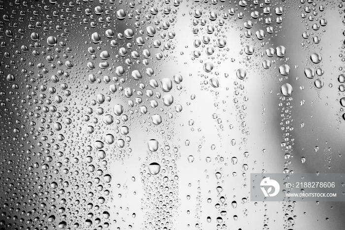 Water drops on glass surface. Droplets texture background