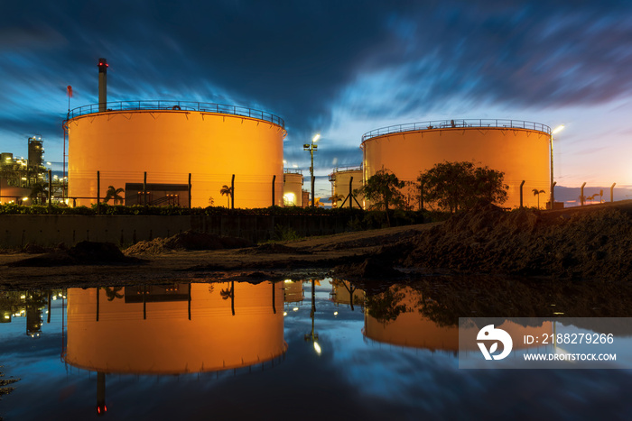 Natural Gas storage tanks and oil tank in industrial plant at twilight