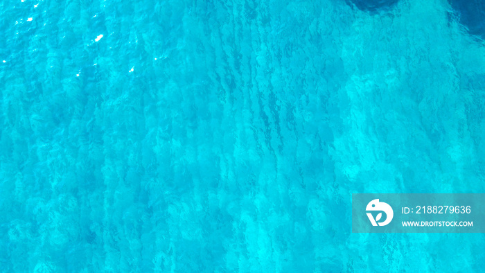 sea from a drone. Blue sea surface from above. Sea surface aerial view. The color of the water and beautifully bright. Aerial view of a crystal clear sea water texture