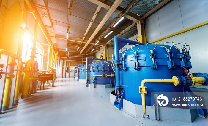 Interior of modern natural oil factory. The piping, pumps and motors