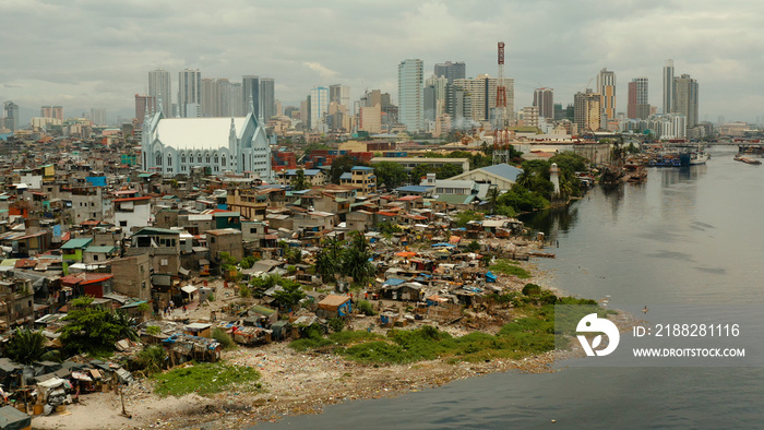 Manila is the capital of the Philippines with slums and poor district and skyscrapers and modern buildings.