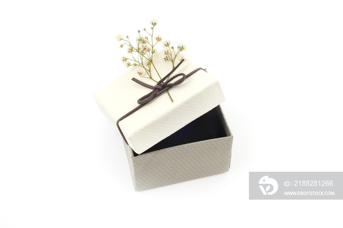 Craft gift boxes small flower on white background. Copy space for text message.