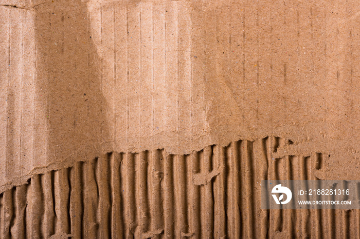 Top view of torn edges corrugated brown cardboard sheet of paper texture or background flat lay, Folded recycle carton paper box