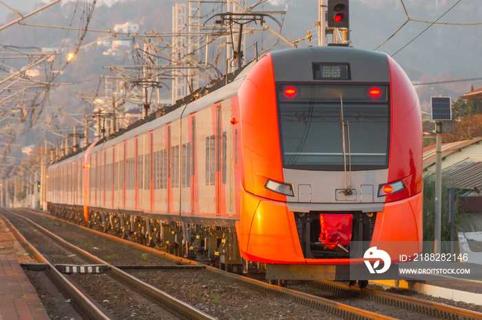 Express train leaves far from the station along the route.