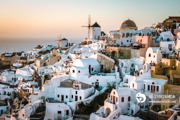 Santorini Island Oia Greece Europe, sunset at the white village of Oia Santorini with old blue and white Greek churches at dusk Santorini Greece