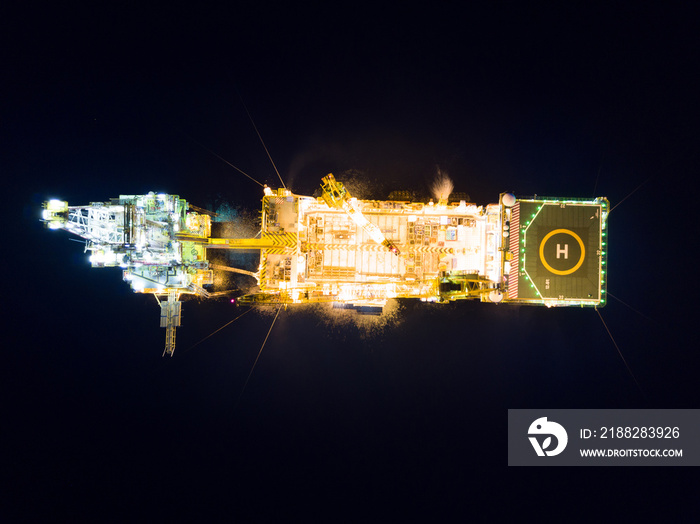 Aerial View of Tender Drilling Oil Rig (Barge Oil Rig) in The Middle of The Ocean at Night