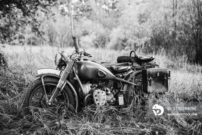 Old Tricar, Three-Wheeled Motorbike Of Wehrmacht, Armed Forces Of Germany Of World War II Time In Summer Forest. Photo In Black And White Colors