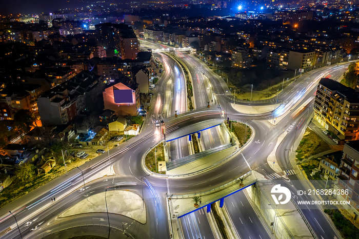 Amazing circle junction traffic road with car light movement aerial view from a drone.