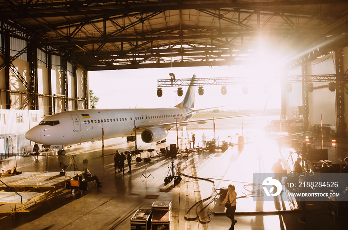 Airplane in the hangar and musical instruments during the concert