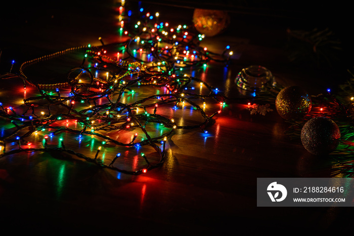 Christmas garland on the floor in the dark