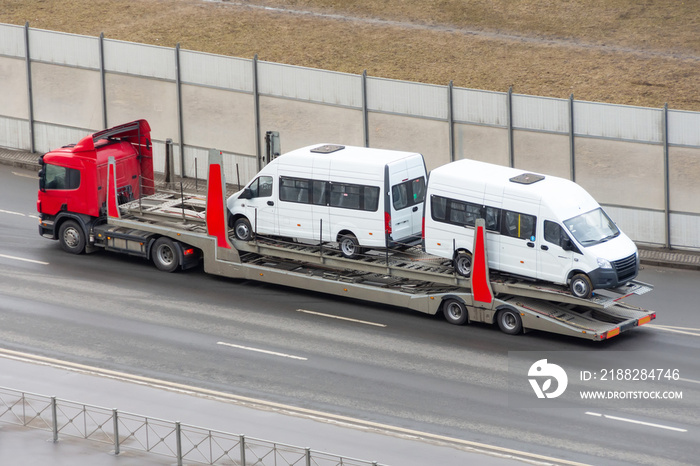 New minibuses to be transported on a trailer truck, delivery to dealers.