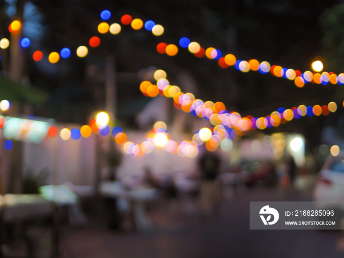 Vintage tone colorful of light abstract blur image of Night festival on street with light bokeh for background usage