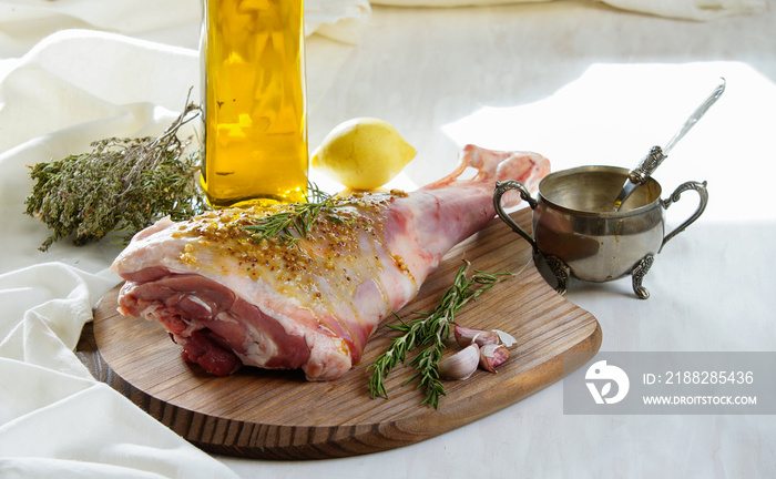 lamb leg raw with olive oil and mustard seeds marinade